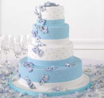 torta nuziale con decorazioni blu